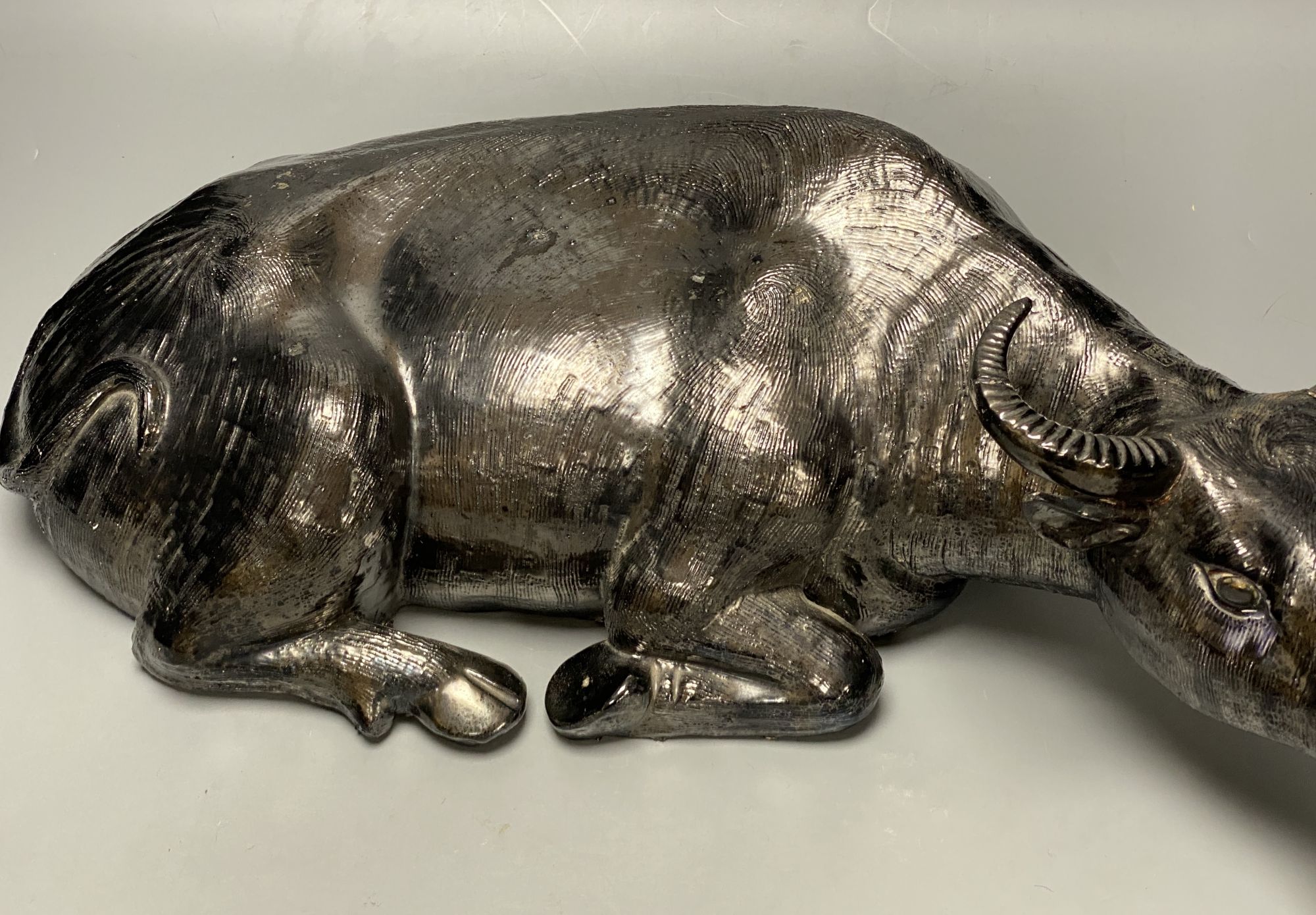 A Chinese pottery model of a recumbent buffalo, length 56cm